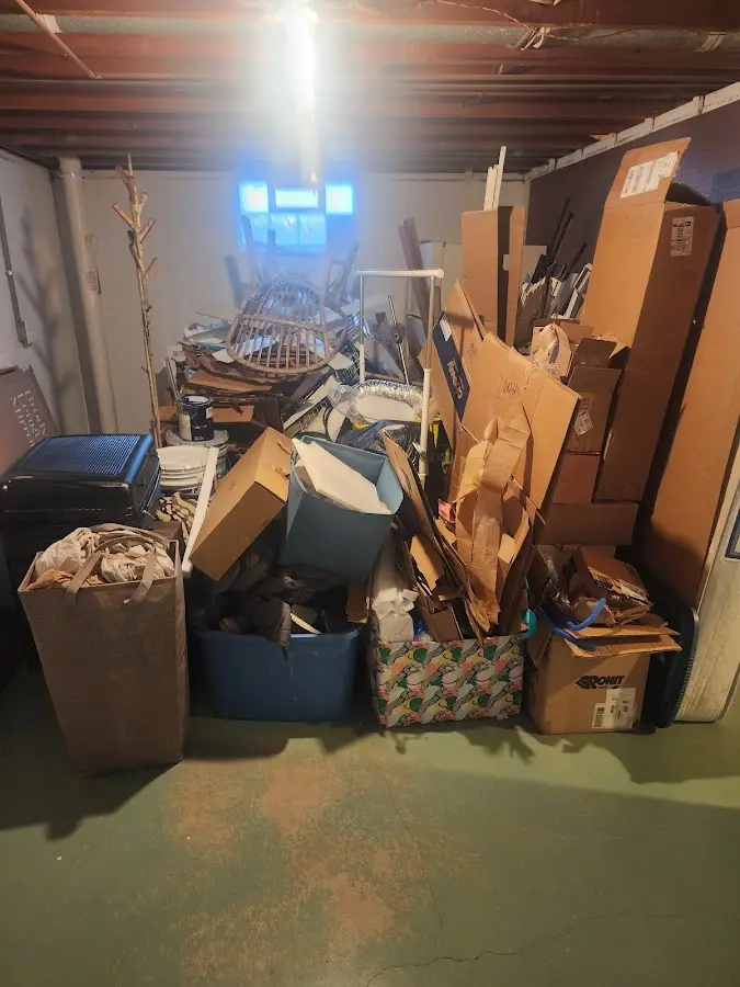 Roll-off dumpster container at job site for Yard Waste Dumpster Rental in Winchester